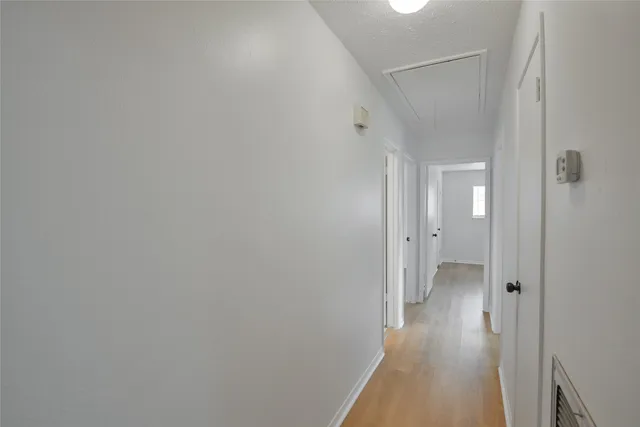 a view of a hallway with a room