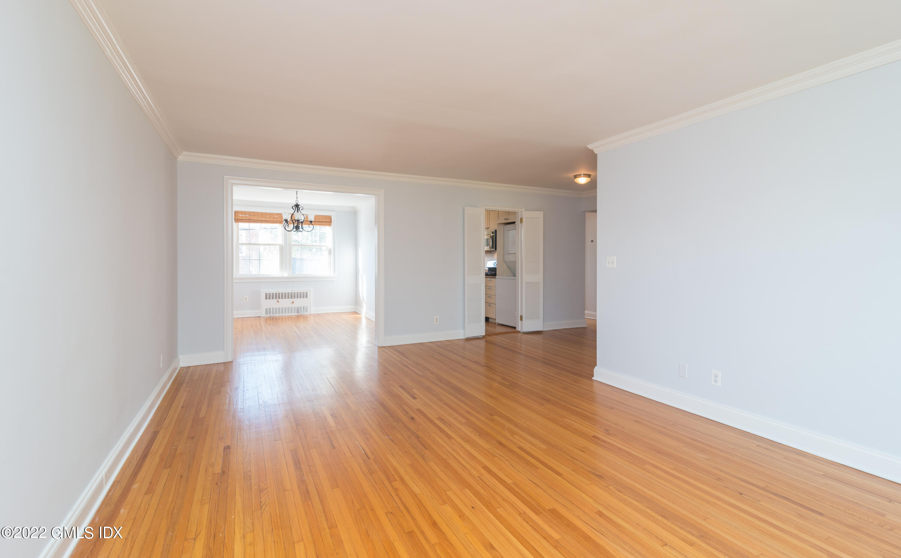 70 Putnam Park, Unit 70 Greenwich, CT 06830 - Photo 13 of 20 a view of a room with wooden floor and a window