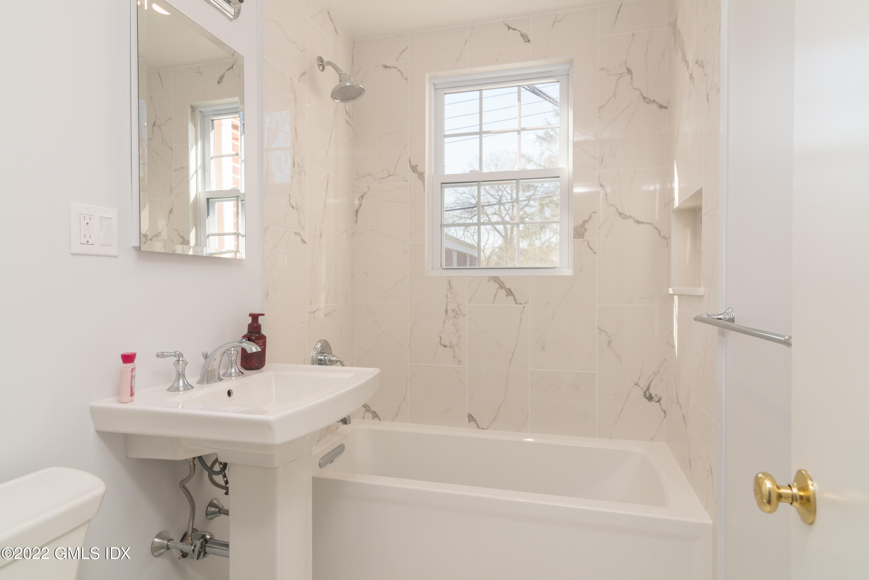 70 Putnam Park, Unit 70 Greenwich, CT 06830 - Photo 15 of 20 a bathroom with a sink a toilet and shower