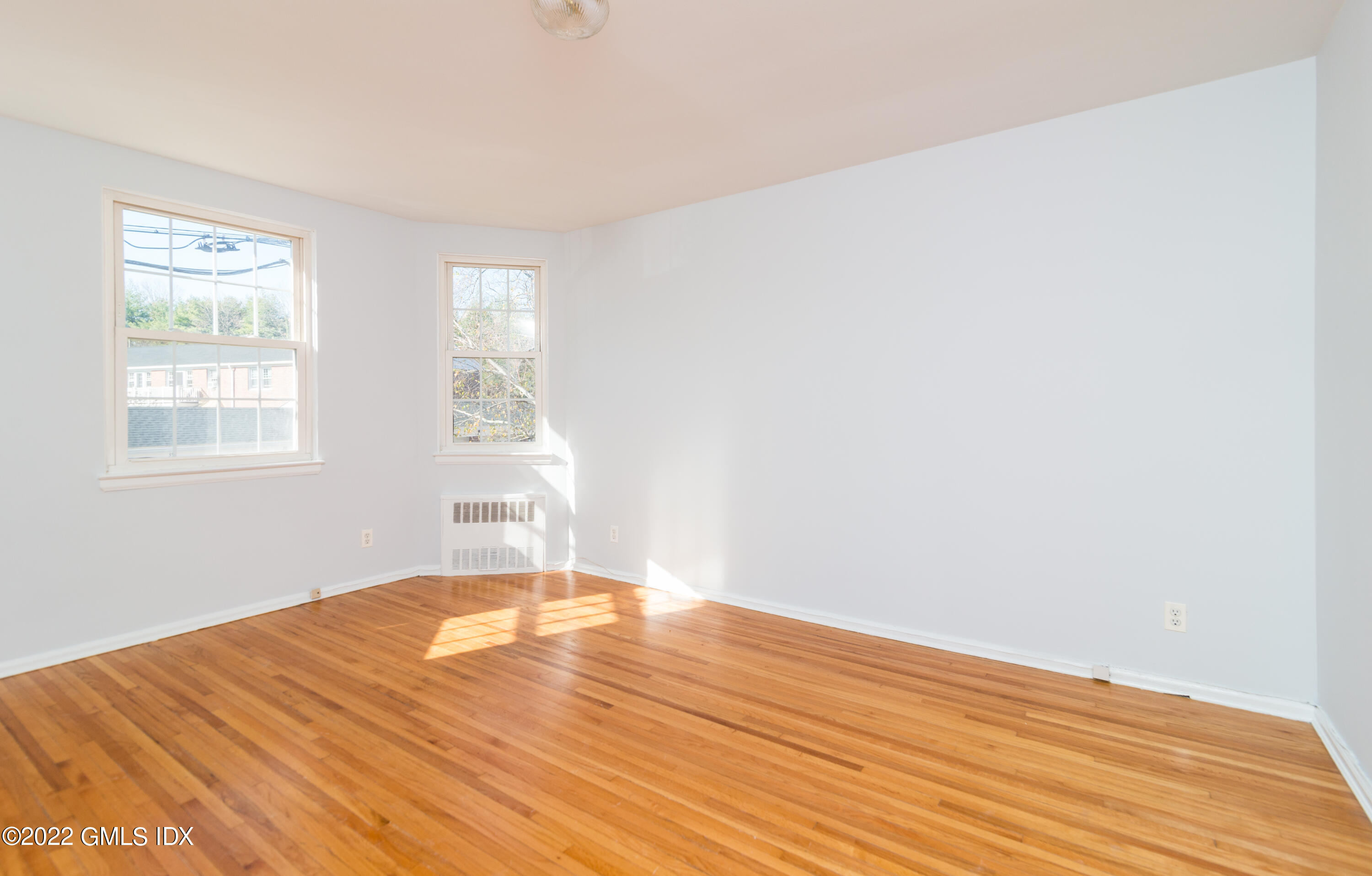 70 Putnam Park, Unit 70 Greenwich, CT 06830 - Photo 16 of 20 a view of empty room with wooden floor and fan