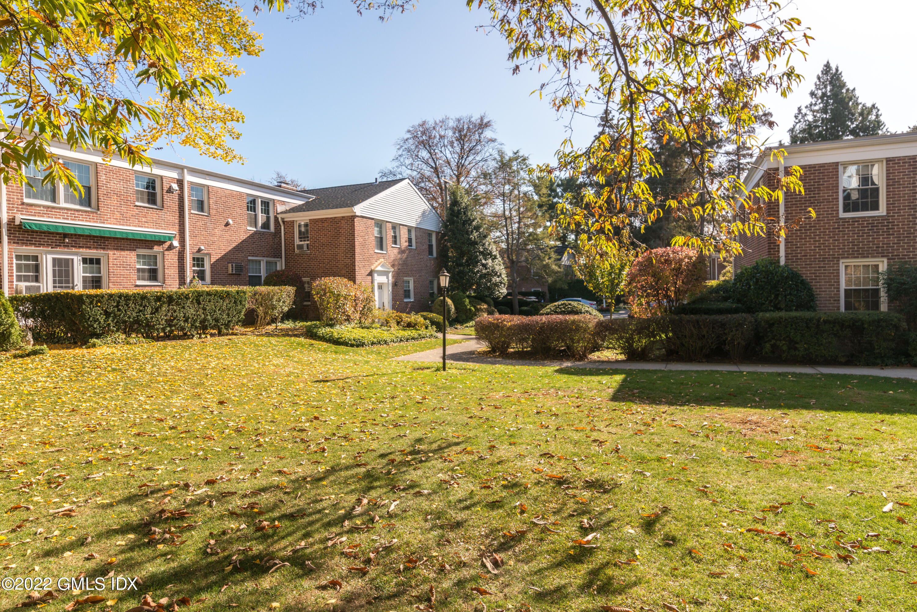 70 Putnam Park, Unit 70 Greenwich, CT 06830 - Photo 4 of 20 a front view of a house with swimming pool