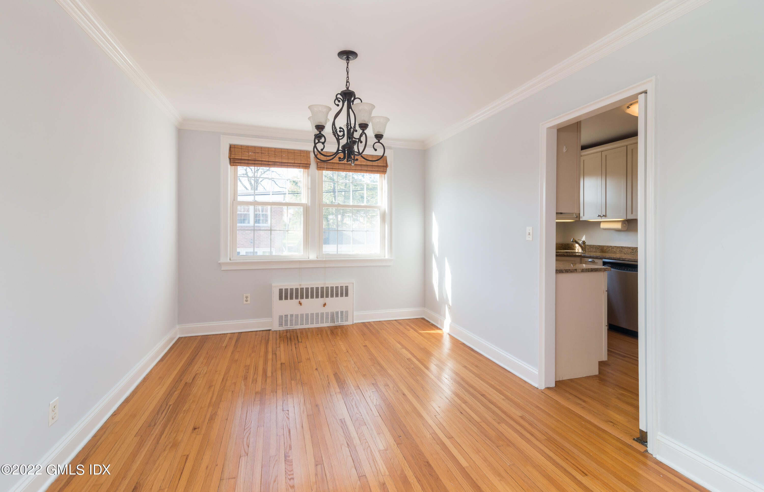 70 Putnam Park, Unit 70 Greenwich, CT 06830 - Photo 8 of 20 wooden floor in an empty room with a window