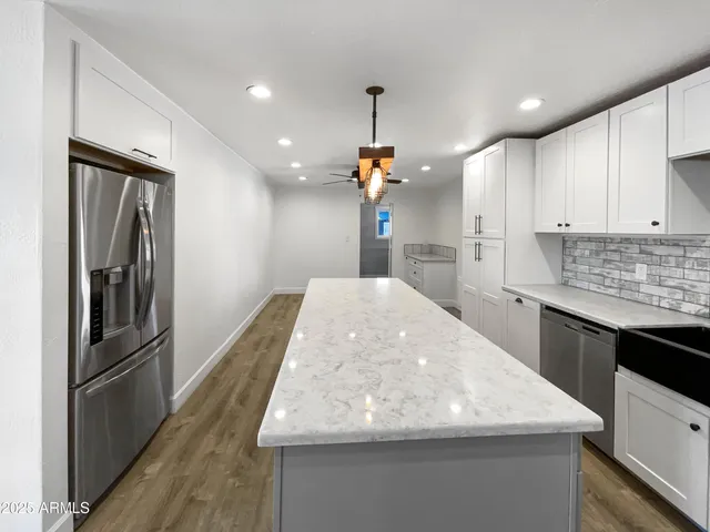 a kitchen with refrigerator and countertop