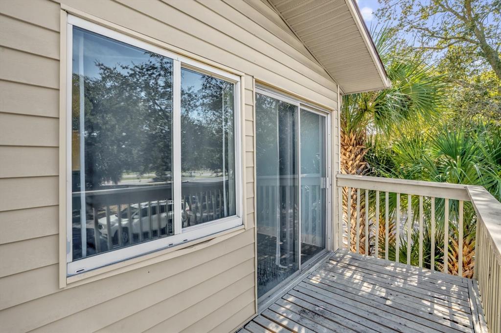 1121 Spring Meadow Drive, Unit 11221 Kissimmee, FL 34741 - Photo 22 of 28 a view of a balcony with wooden floor
