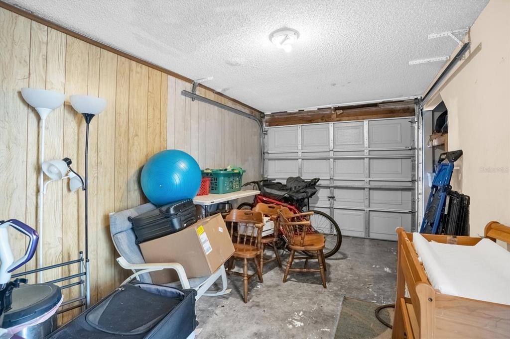 1121 Spring Meadow Drive, Unit 11221 Kissimmee, FL 34741 - Photo 23 of 28 a room with furniture a rug and a window