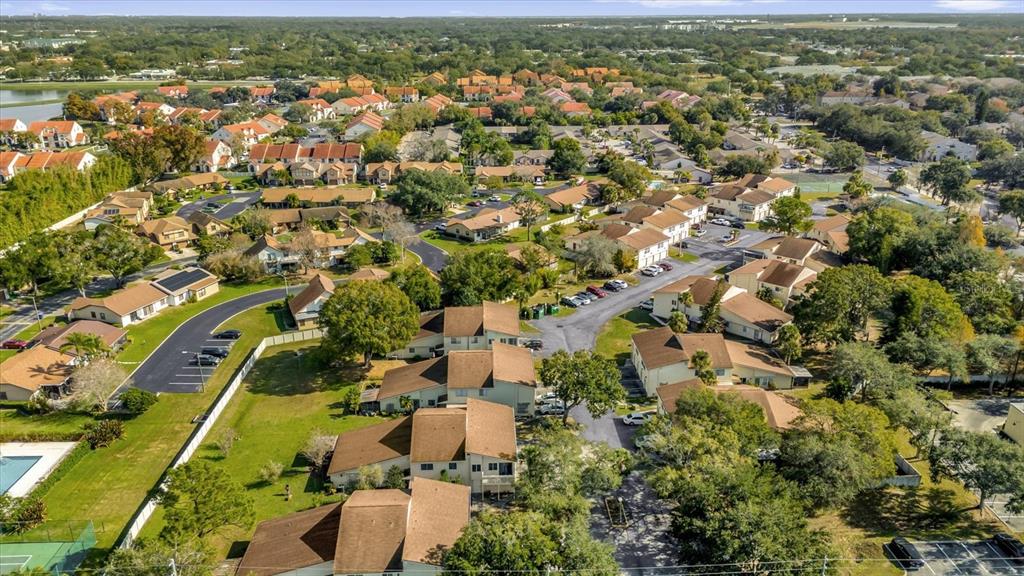 1121 Spring Meadow Drive, Unit 11221 Kissimmee, FL 34741 - Photo 25 of 28 an aerial view of residential houses with outdoor space