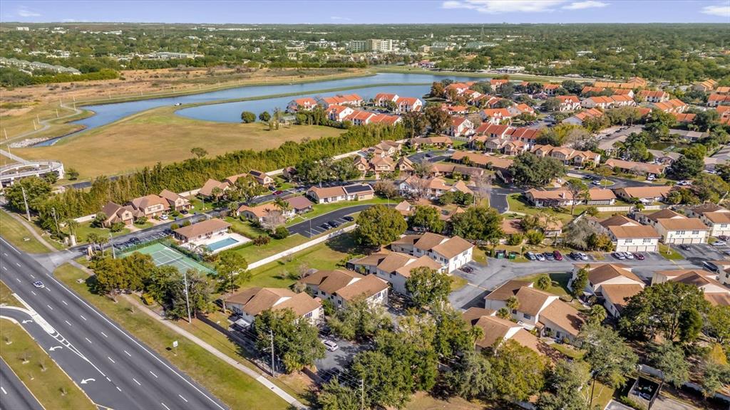 1121 Spring Meadow Drive, Unit 11221 Kissimmee, FL 34741 - Photo 28 of 28 an aerial view of residential houses with outdoor space