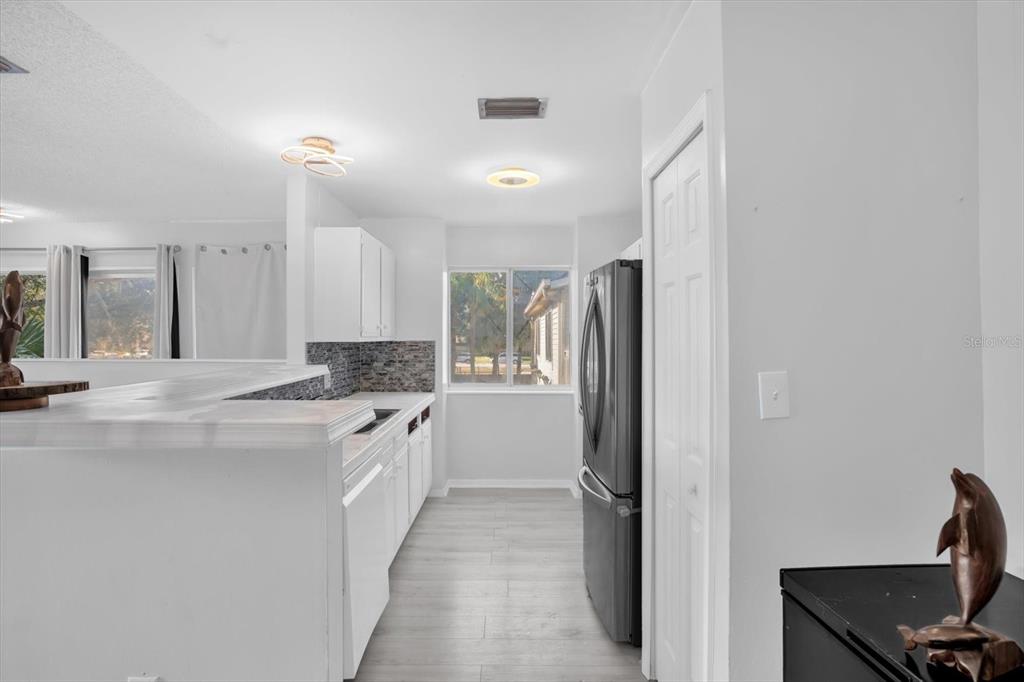1121 Spring Meadow Drive, Unit 11221 Kissimmee, FL 34741 - Photo 9 of 28 a large bathroom with a double vanity sink and a mirror