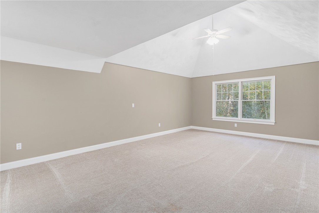 132 Channel View, Unit 3 Warwick, RI 02889 - Photo 37 of 50 Upstairs bedroom w/vaulted ceiling, walk-in closet and access to walk-in attic storage.