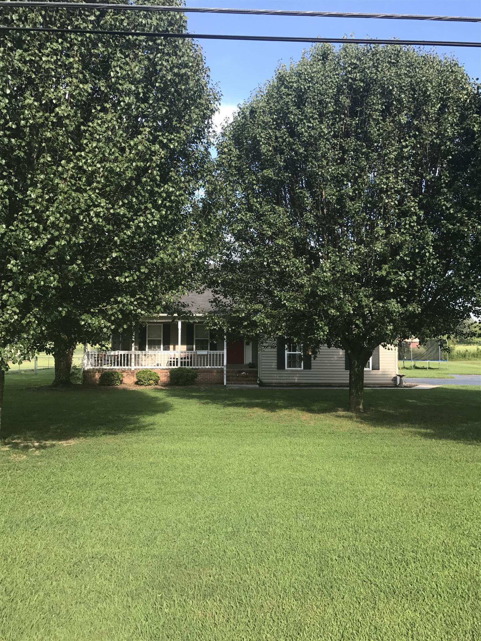 501 Rock Road Morrison, TN 37357 - Photo 2 of 22 a front view of a house with a yard