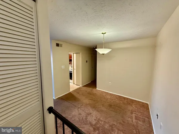 an empty room with a bathroom
