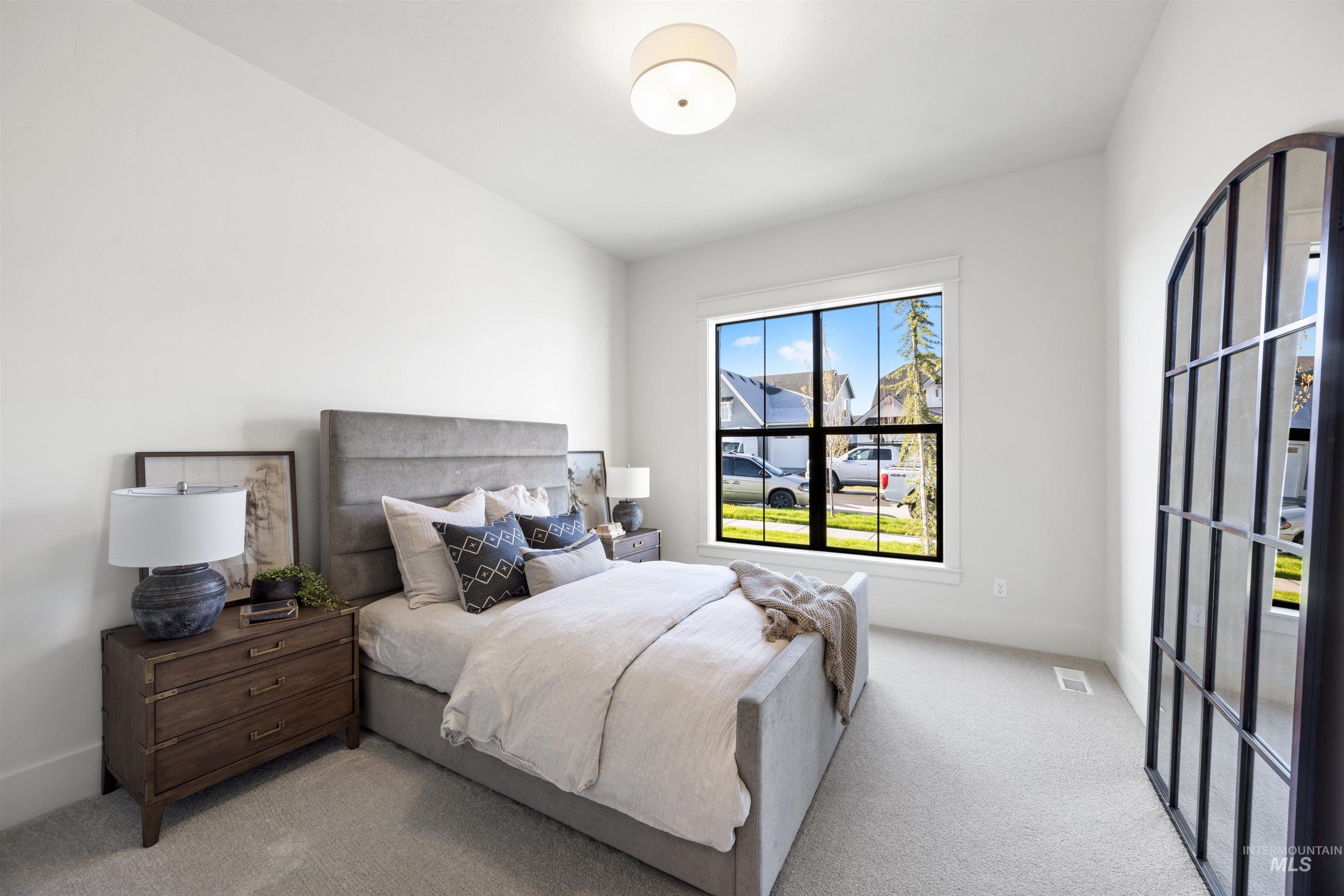 5847 South Pinpoint Way Meridian, ID 83642 - Photo 5 of 44 Bedroom featuring light colored carpet and baseboards