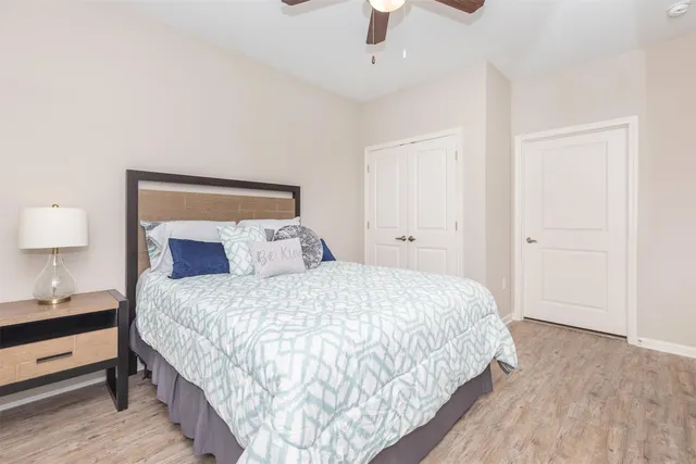 a bedroom with bed and window