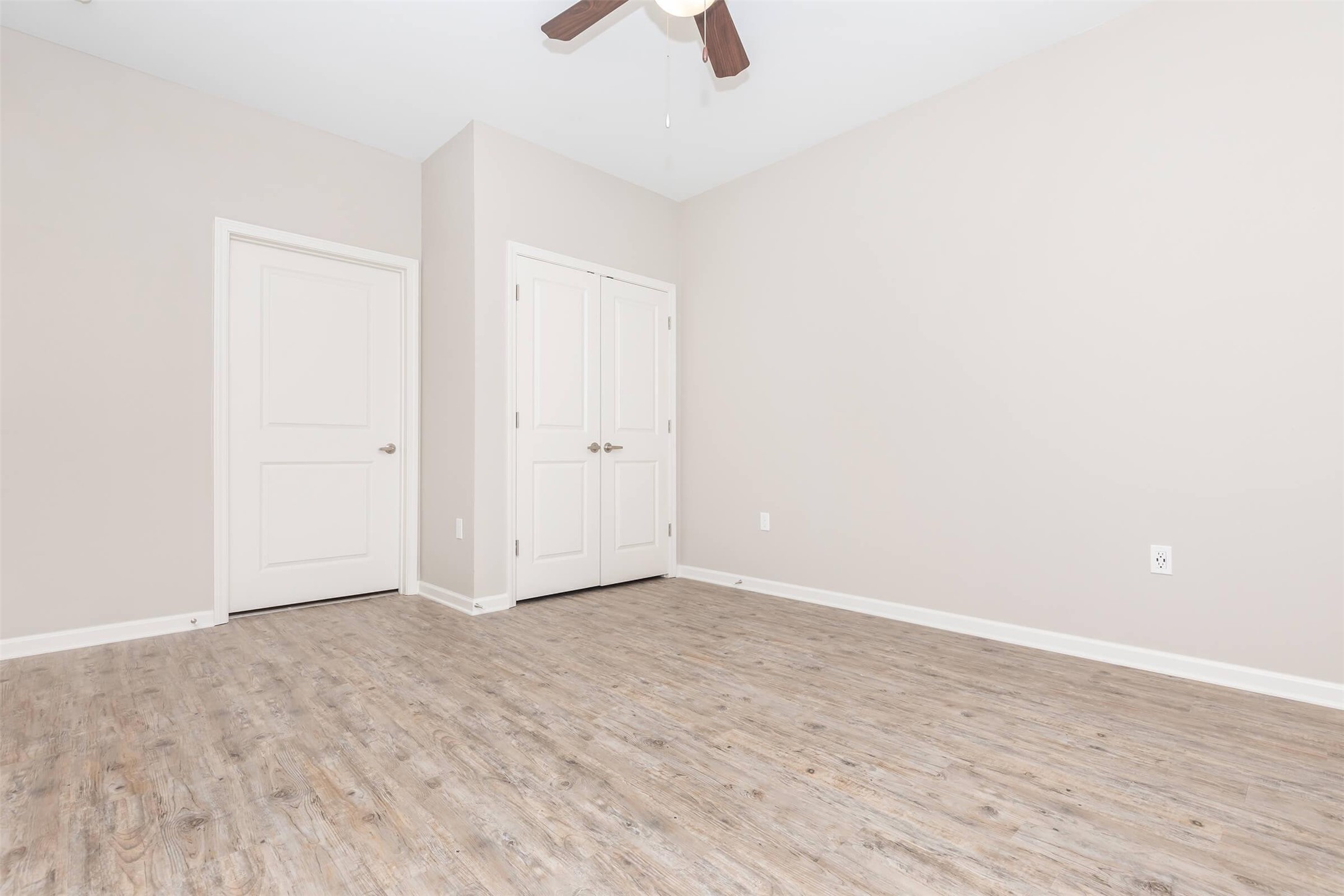 11777 Nicholson Drive Baton Rouge, LA 70810 - Photo 19 of 24 an empty room with view of a ceiling fan and wooden floor