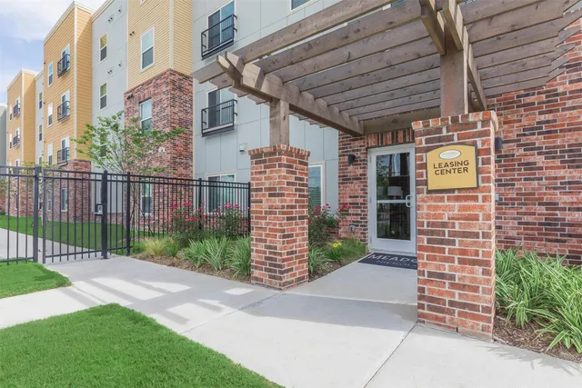 a view of a pathway with a wooden fence