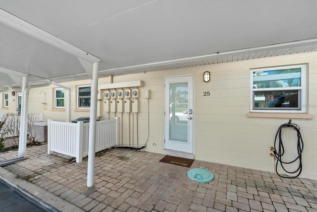 5830 Midnight Pass Road, Unit 25 Sarasota, FL 34242 - Photo 17 of 29 a view of a livingroom with furniture and floor to ceiling window
