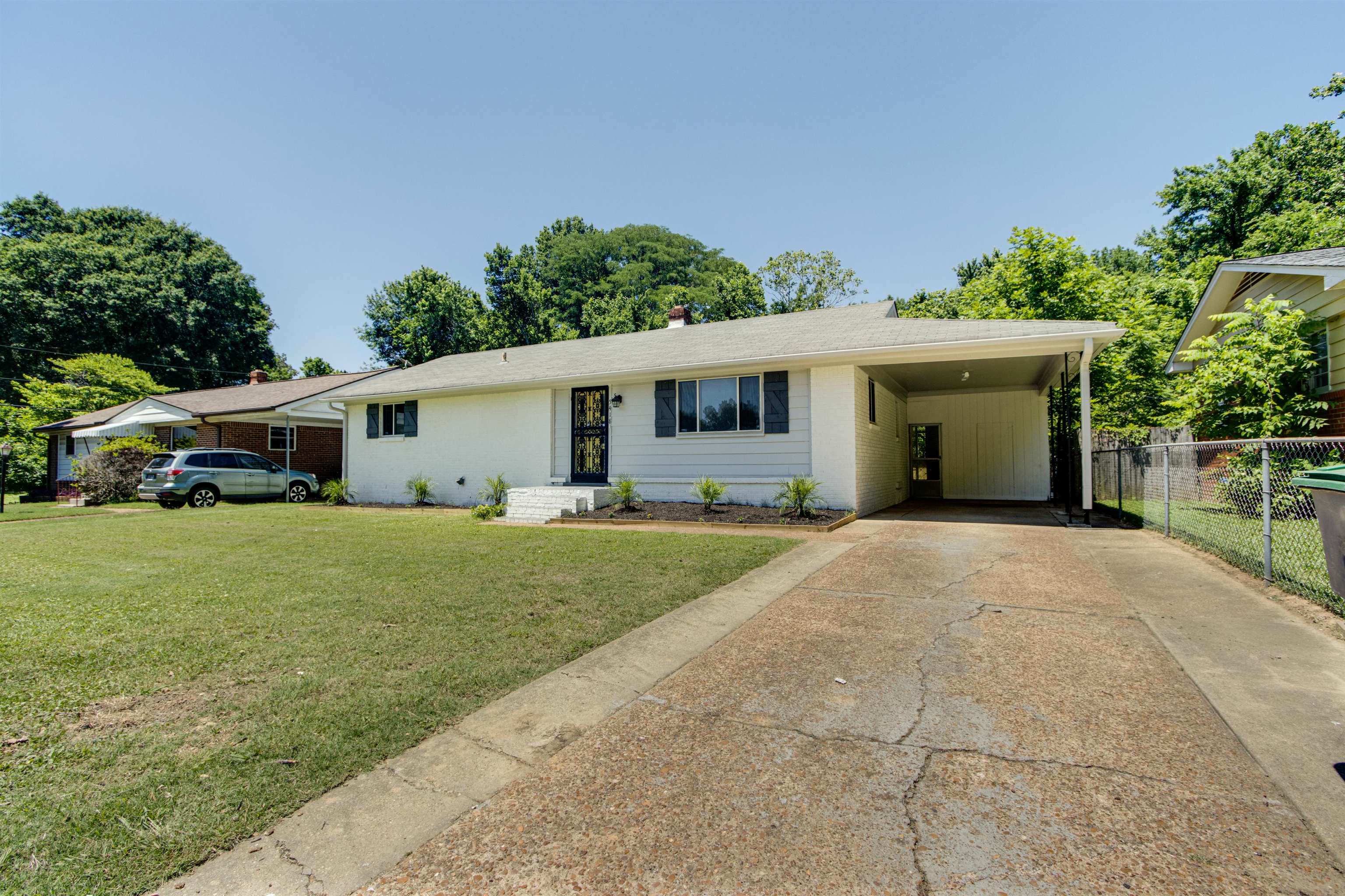 5418 Mesquite Road Memphis, TN 38120 - Photo 1 of 21 Ranch-style home with a carport and a front yard