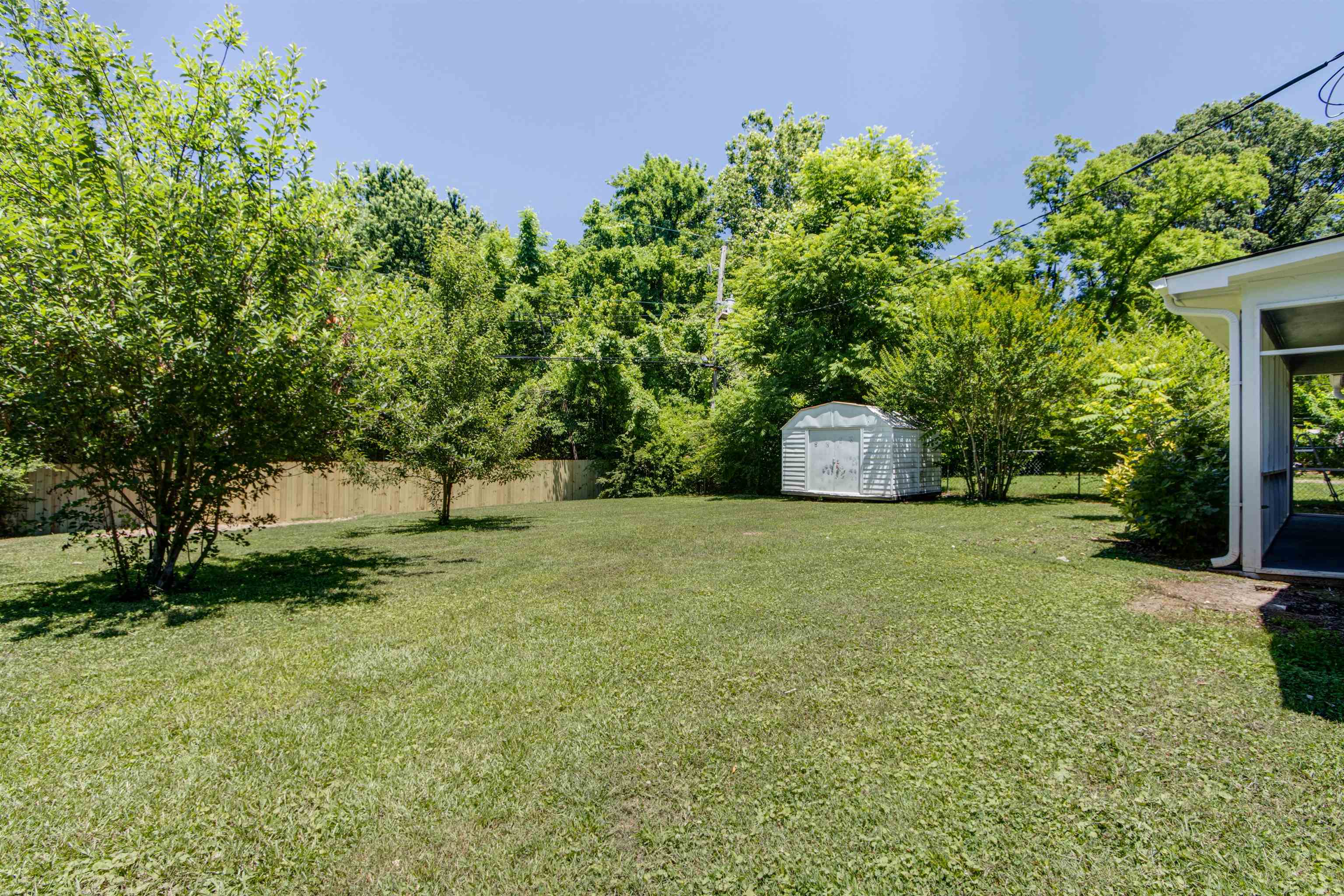 5418 Mesquite Road Memphis, TN 38120 - Photo 21 of 21 View of yard with a storage shed