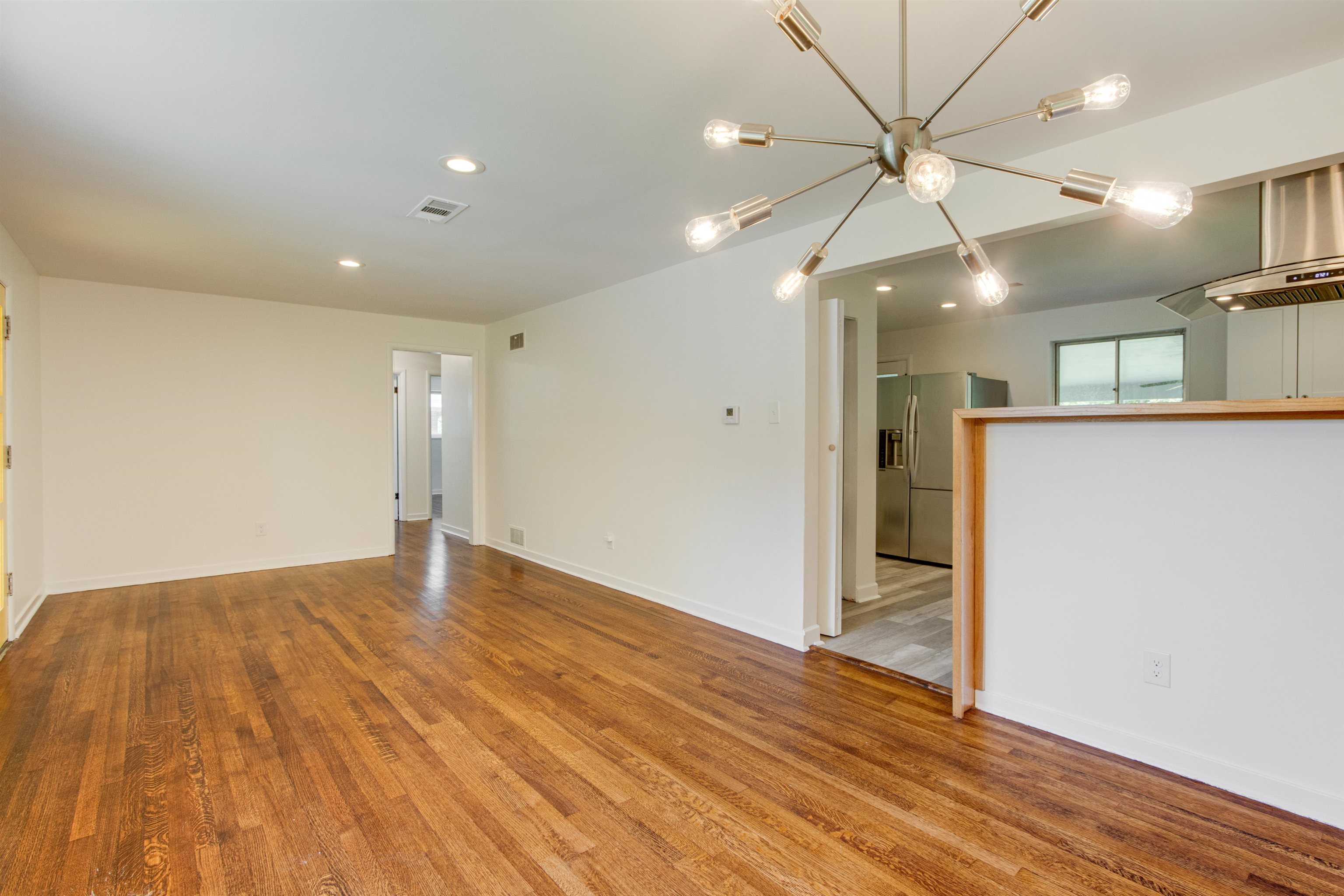 5418 Mesquite Road Memphis, TN 38120 - Photo 4 of 21 Unfurnished living room with hardwood / wood-style floors