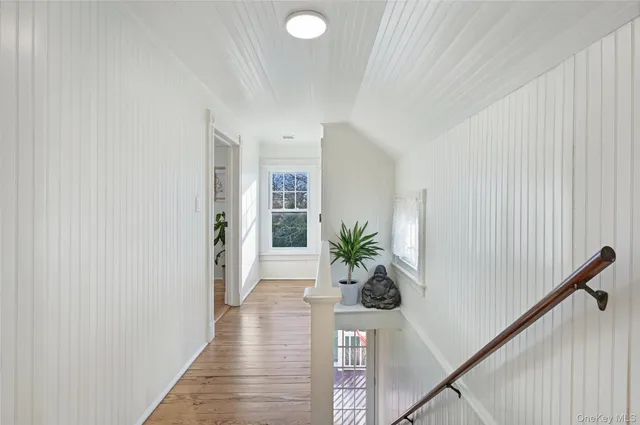 a view of entryway with wooden floor