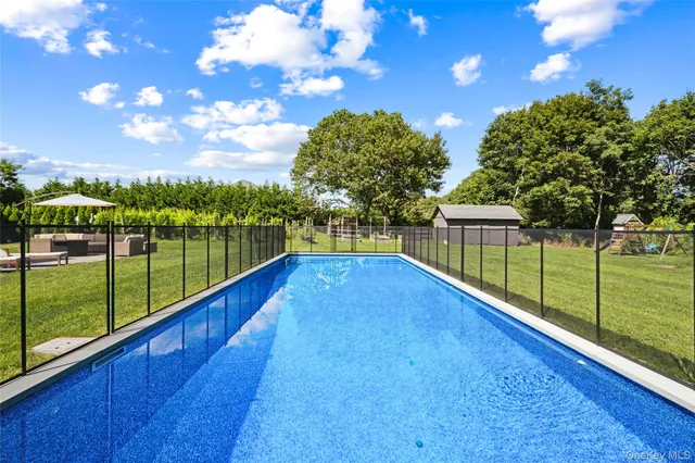 a view of a backyard with a lake view