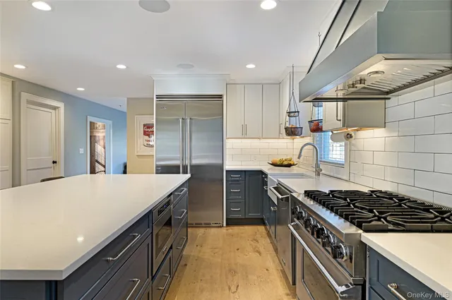 a kitchen with a stove and a refrigerator