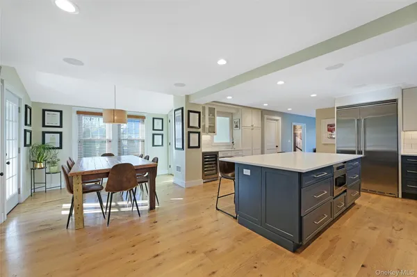 a kitchen with stainless steel appliances granite countertop counter top space and wooden floor