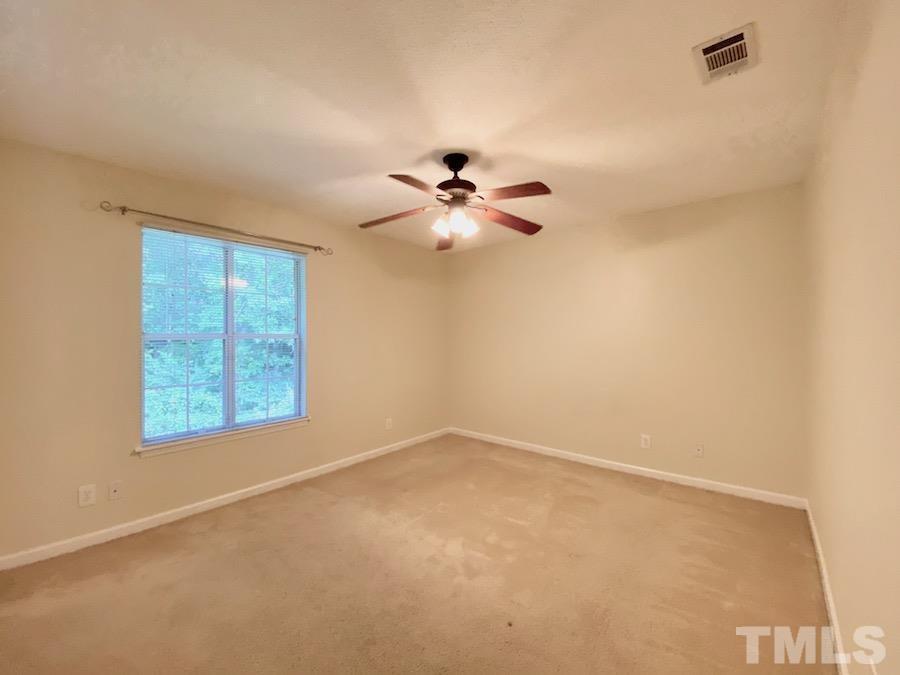 2126 Alpine Road Durham, NC 27707 - Photo 12 of 19 an empty room with a window and a ceiling fan