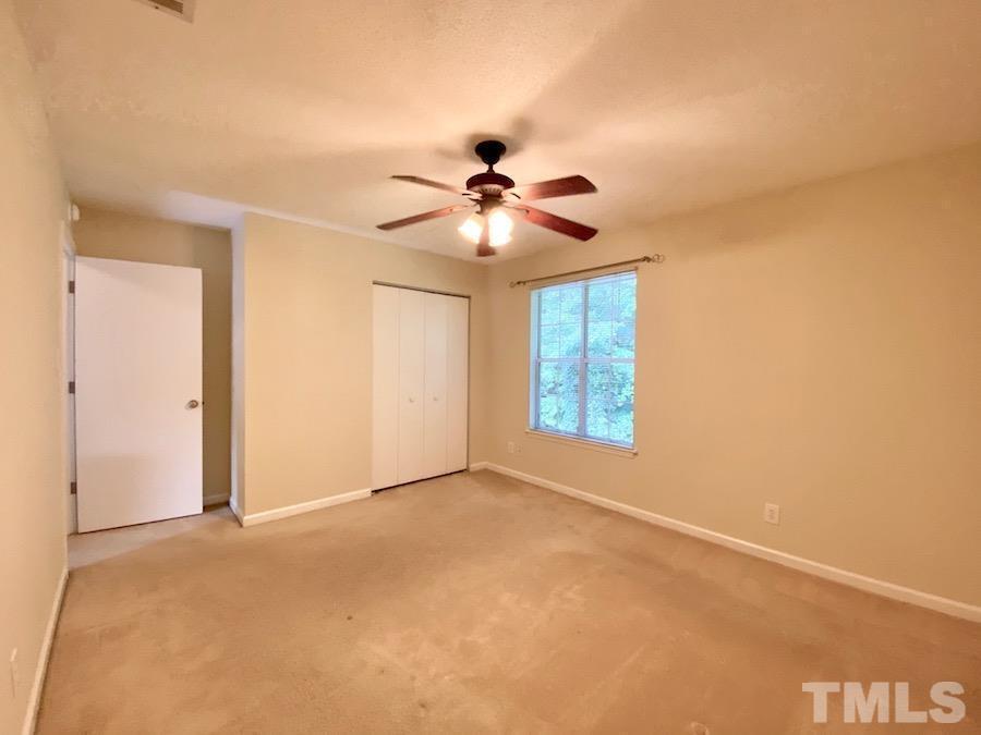 2126 Alpine Road Durham, NC 27707 - Photo 13 of 19 a view of a room with a ceiling fan and a window