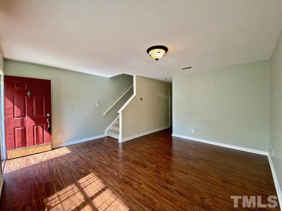 2126 Alpine Road Durham, NC 27707 - Photo 5 of 19 a view of an empty room with wooden floor