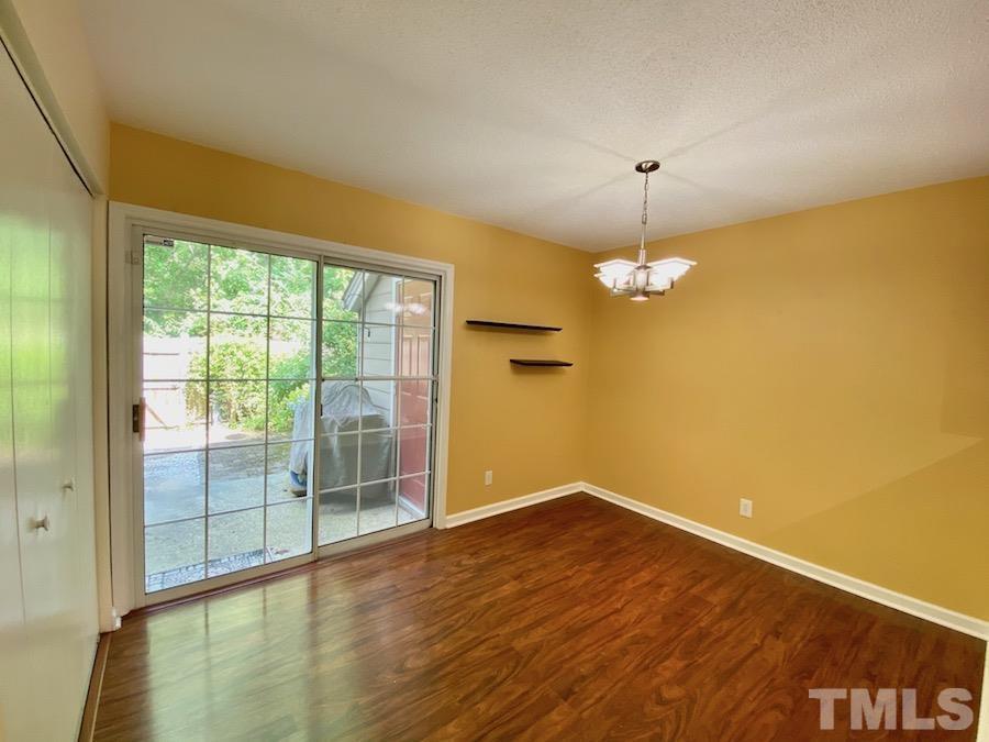 2126 Alpine Road Durham, NC 27707 - Photo 7 of 19 an empty room with wooden floor and windows