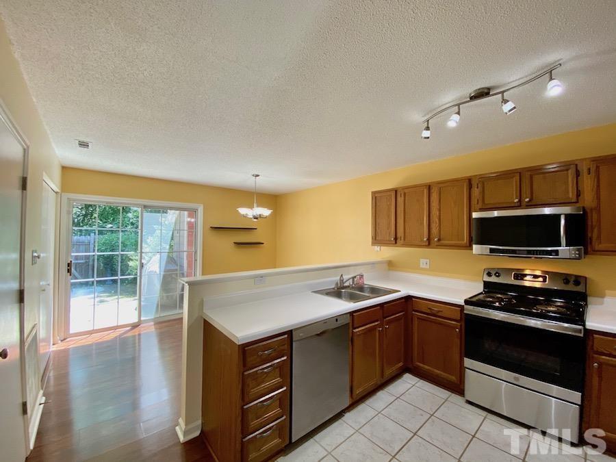 2126 Alpine Road Durham, NC 27707 - Photo 9 of 19 a kitchen with a stove and a sink