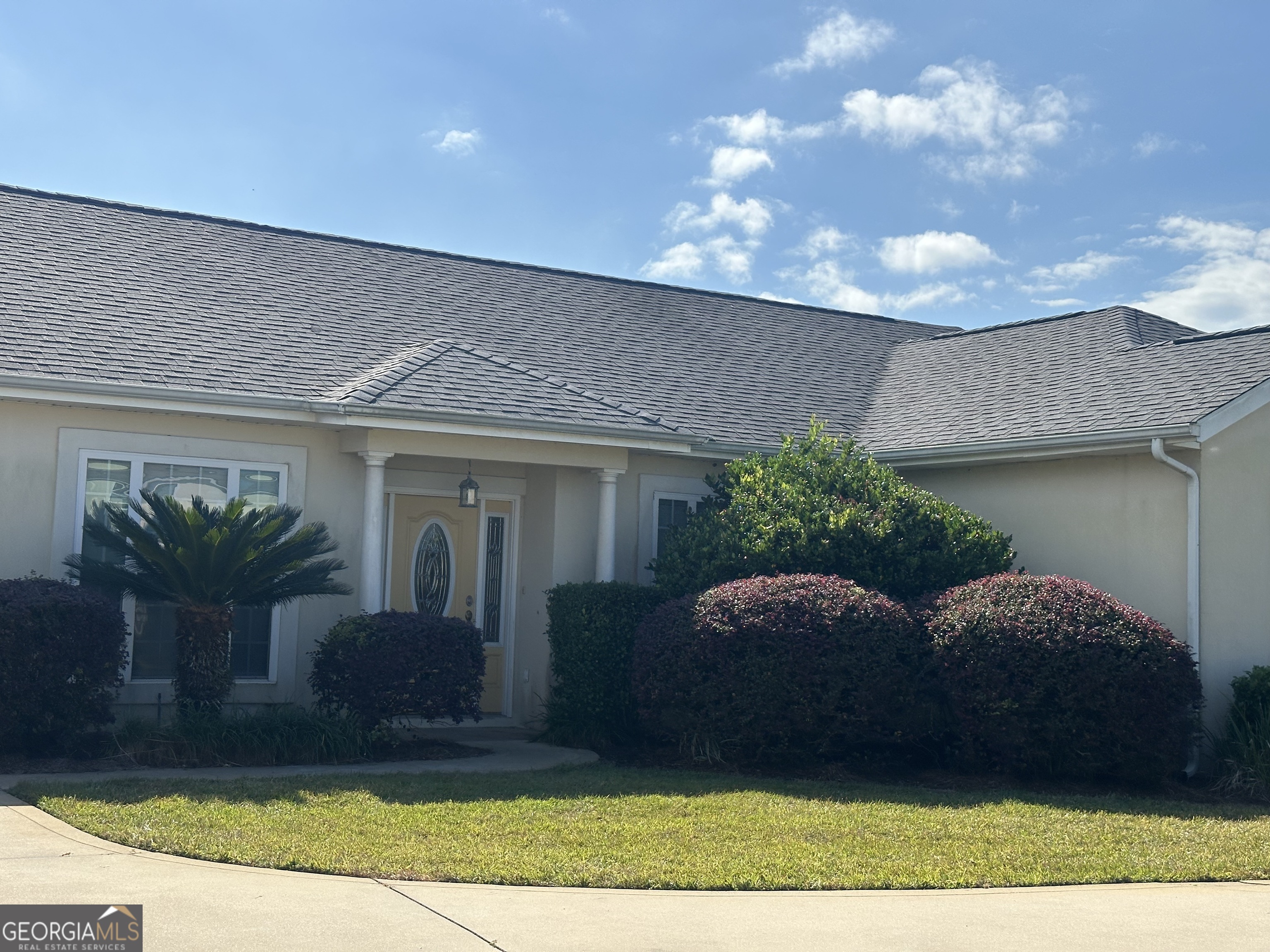 39 Coastal Walk St. Marys, GA 31558 - Photo 1 of 23 a front view of a house with a yard