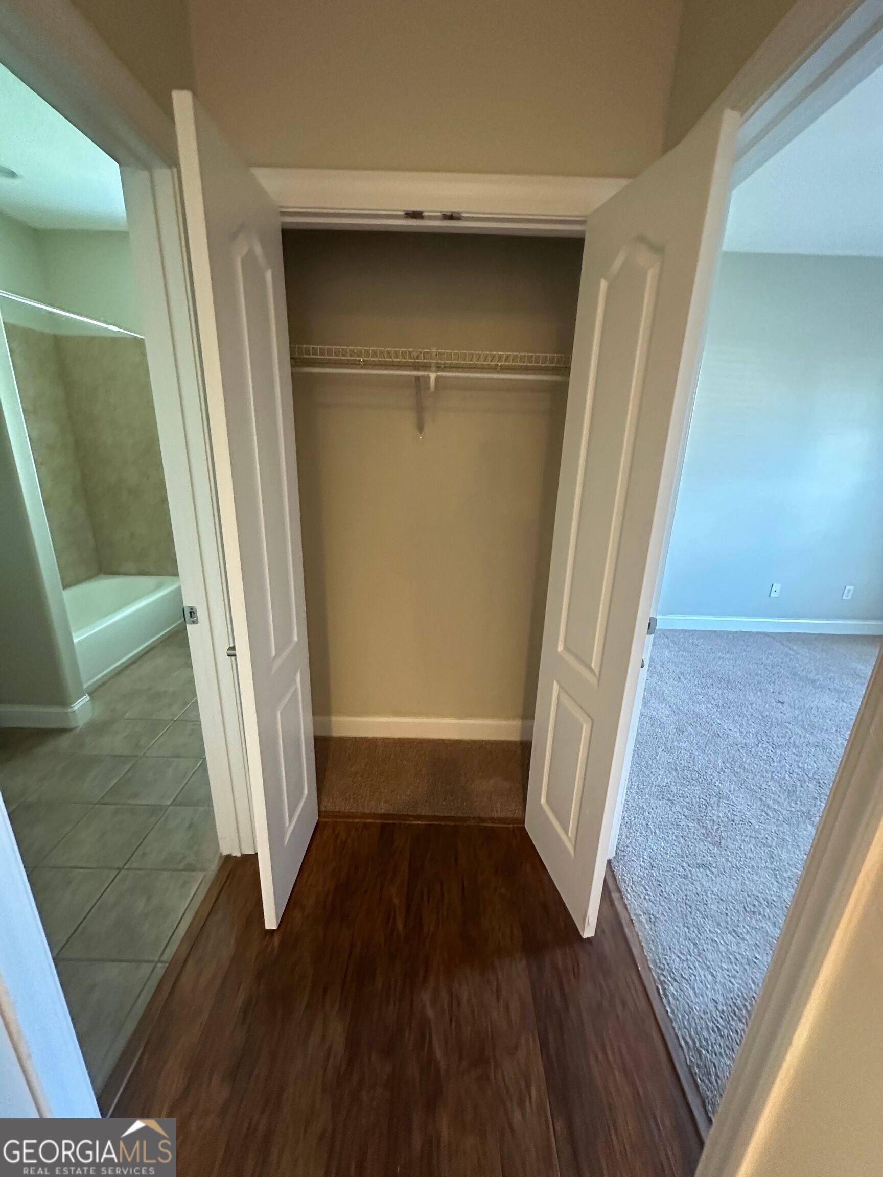 39 Coastal Walk St. Marys, GA 31558 - Photo 11 of 23 view of a hallway with wooden floor and staircase