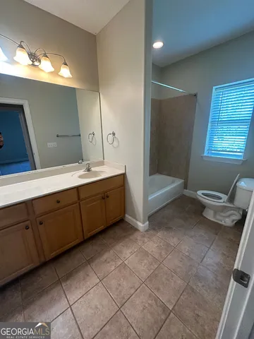 a bathroom with a sink a vanity and mirror