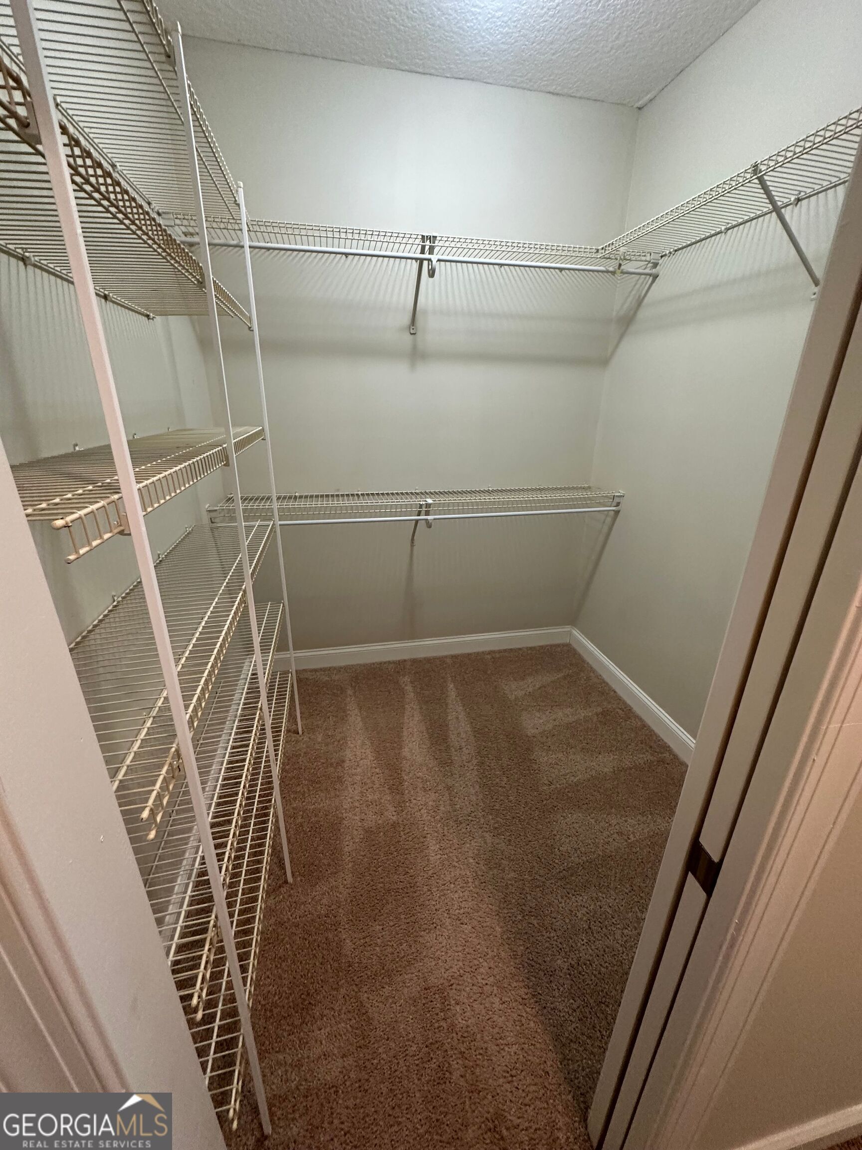 39 Coastal Walk St. Marys, GA 31558 - Photo 14 of 23 a view of a room with racks on the wall