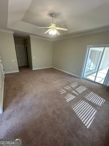 a spacious bathroom with a tub sink and mirror