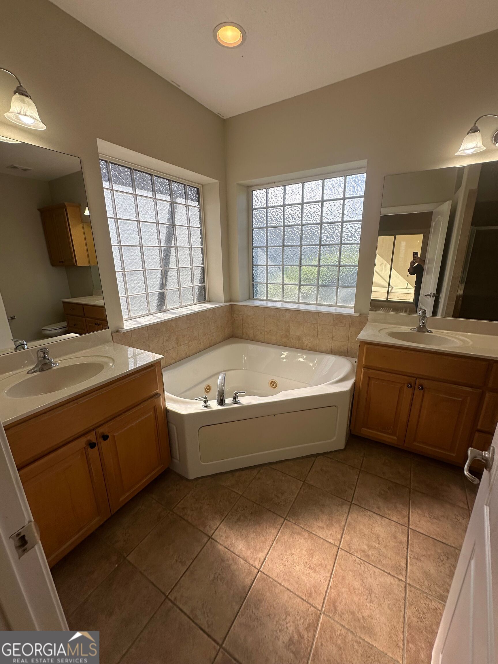 39 Coastal Walk St. Marys, GA 31558 - Photo 18 of 23 a spacious bathroom with a tub sink and mirror