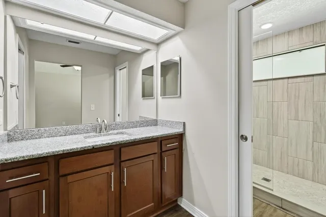 a bathroom with a shower and a toilet