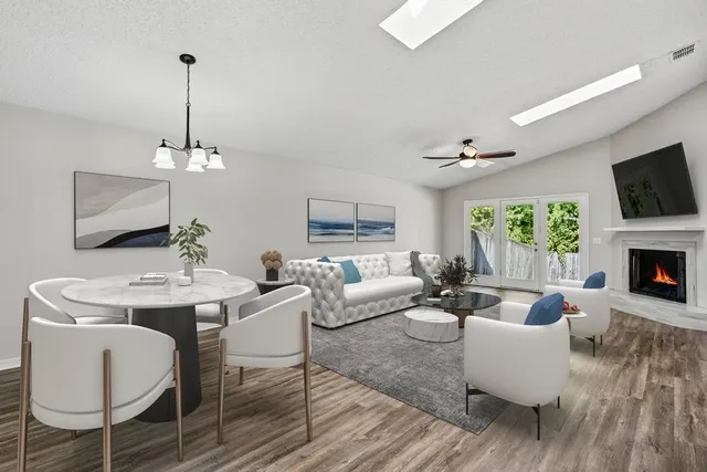 a living room with fireplace furniture and a flat screen tv