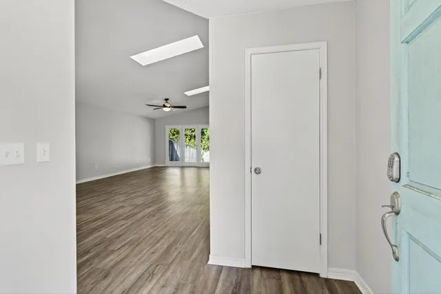 a view of an entryway with wooden floor