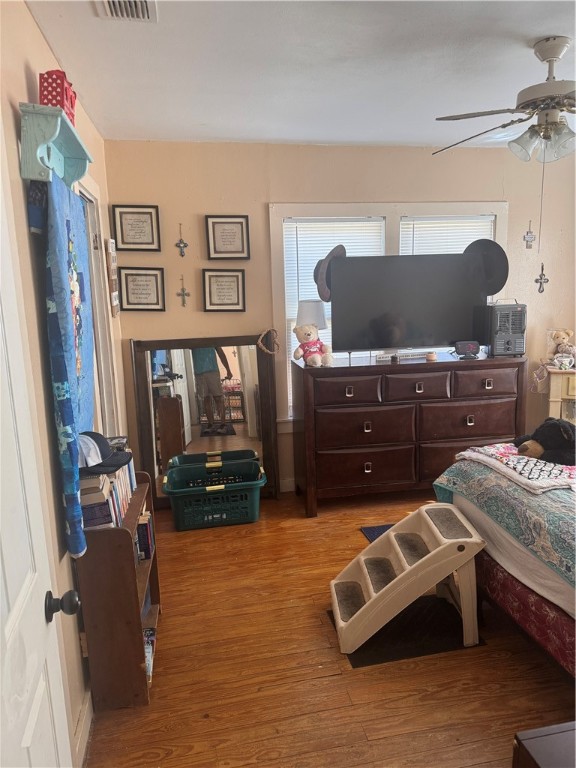 10420 6th Street Pettus, TX 78146 - Photo 11 of 30 a bedroom with a bed dresser and a window