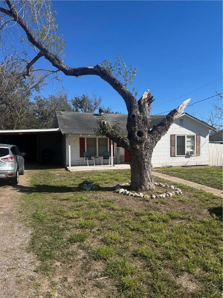 10420 6th Street Pettus, TX 78146 - Photo 2 of 30 a front view of a house with a garden