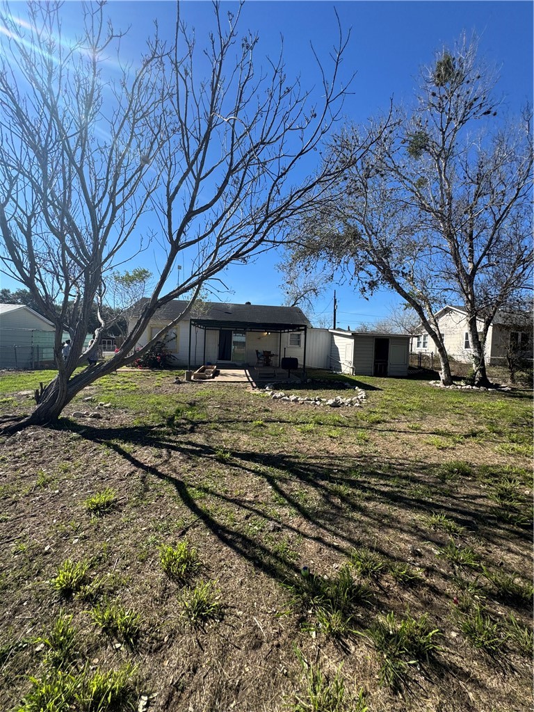 10420 6th Street Pettus, TX 78146 - Photo 24 of 30 a front view of a house with a yard