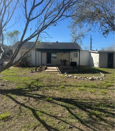 a view of a backyard of a house