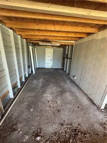 a view of empty room with stairs