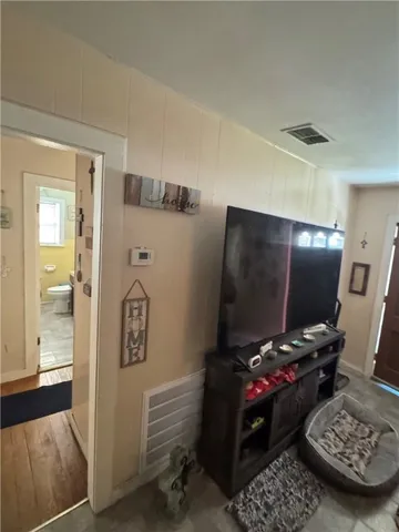 a room with furniture and a flat screen tv