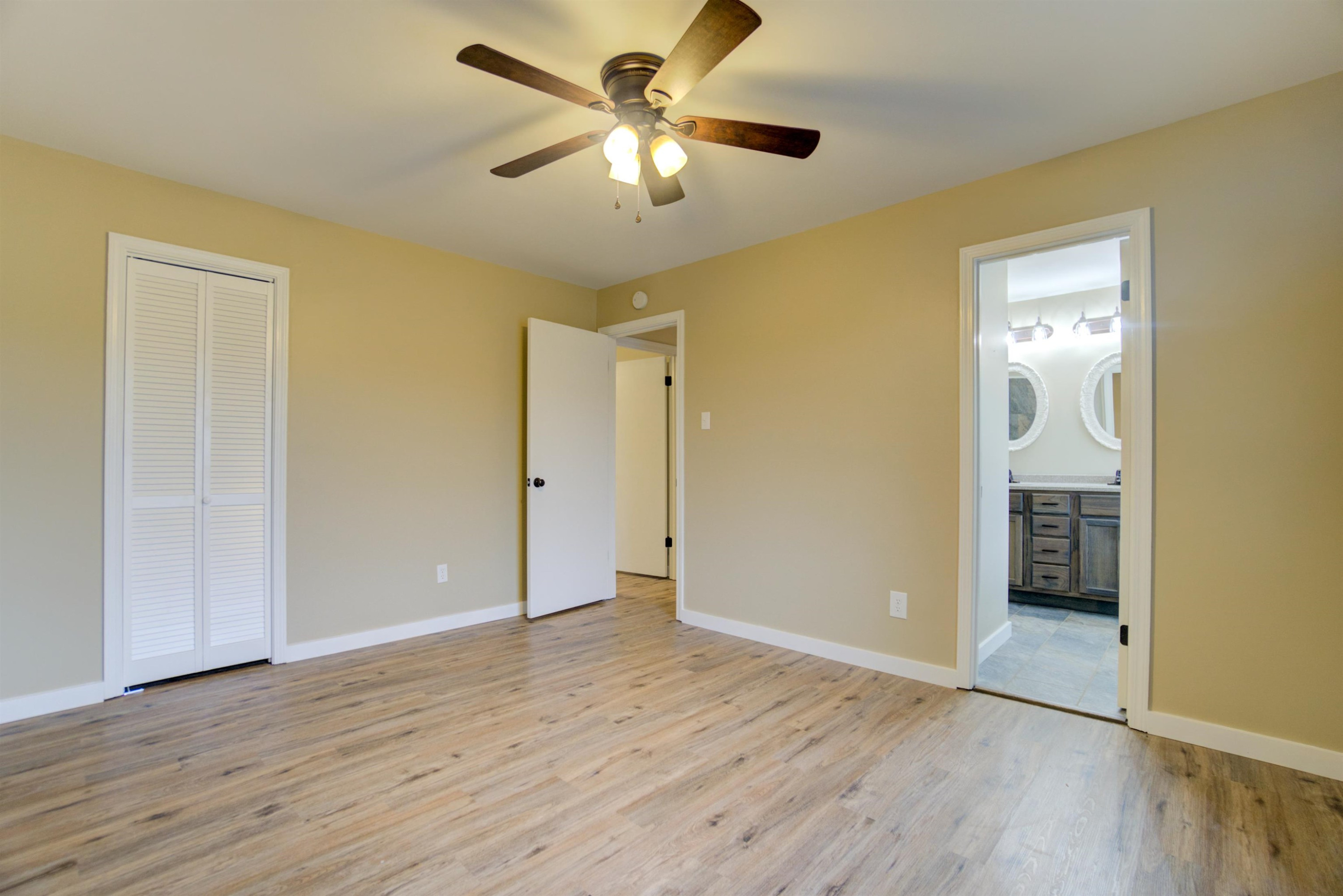 430 Teacher Road Lavinia, TN 38348 - Photo 8 of 20 a view of an empty room and wooden floor