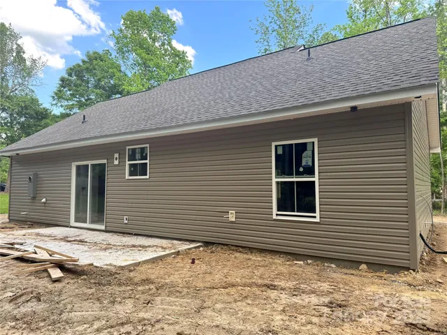 a house with trees in the background