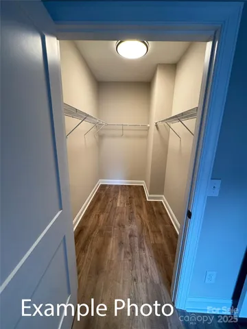 a spacious bathroom with a sink mirror and a bathtub